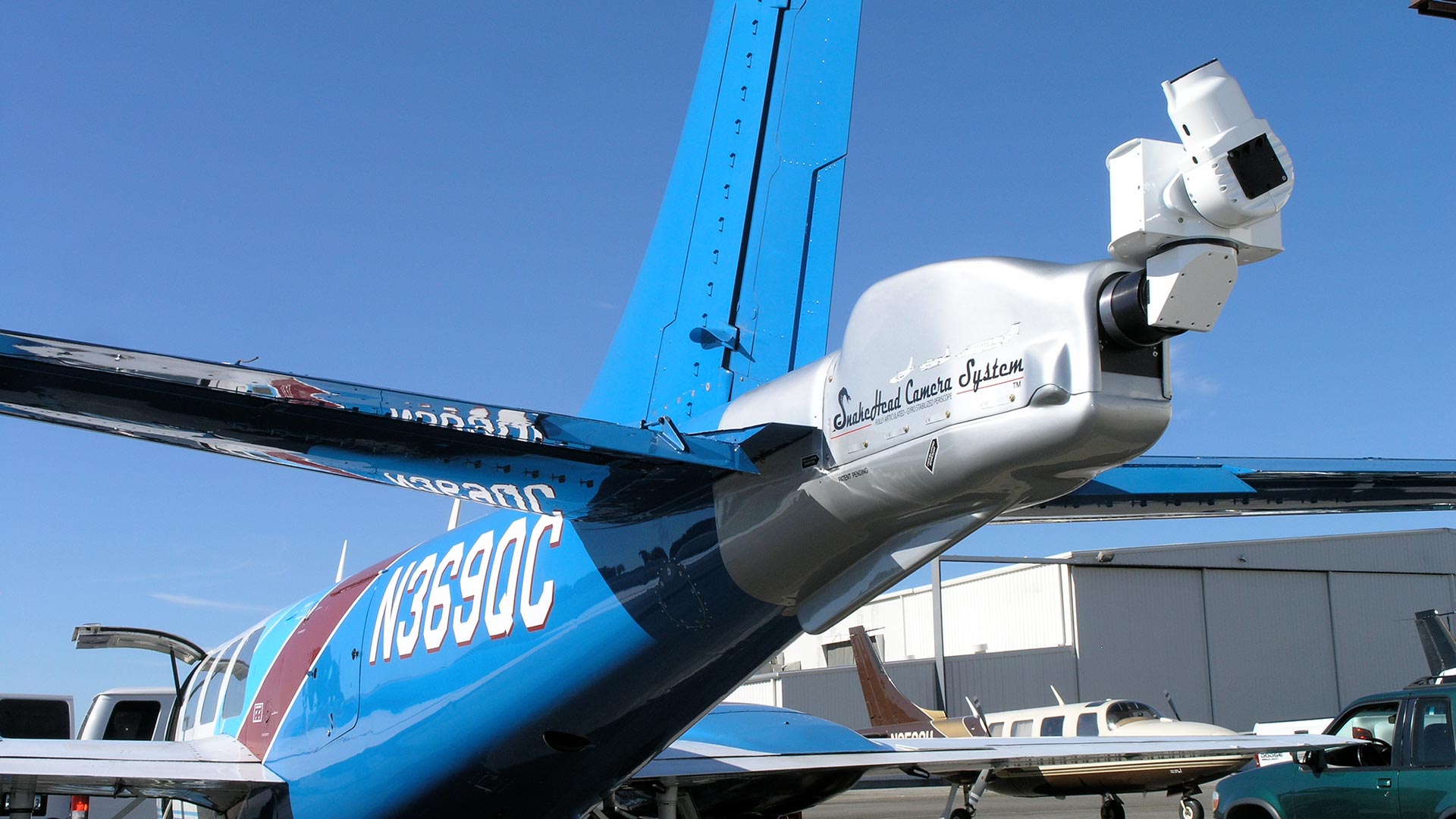 Helicopter low-altitude flight hugging terrain canyon beds